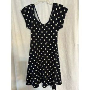Navy & white polka dot dress with scoop neckline and open cross back